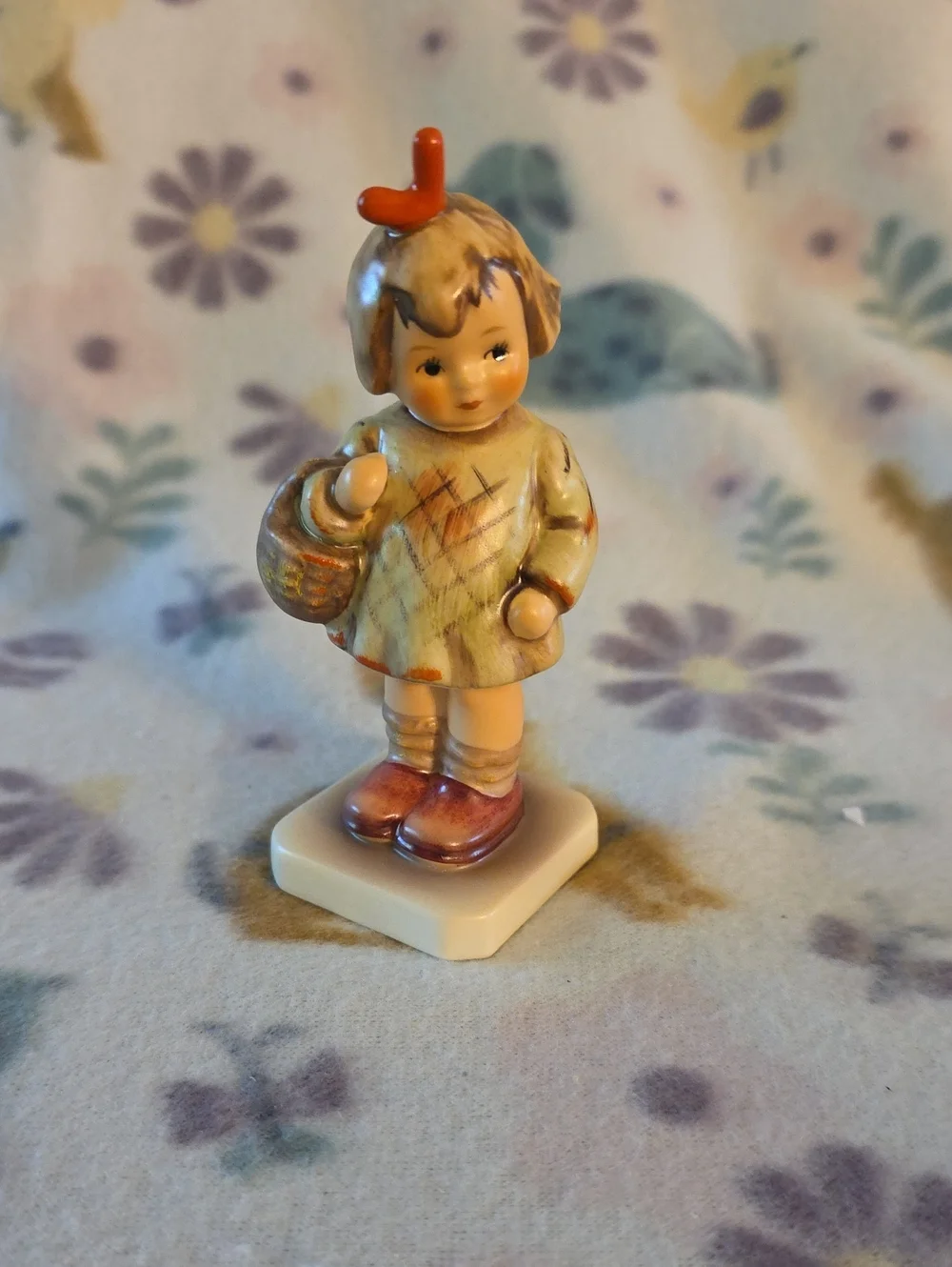 This is a Goebel Hummel figurine titled